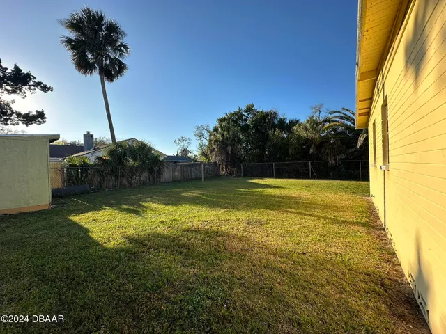 a view of a swimming pool with a house