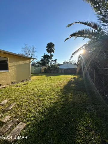 a view of a swimming pool with an outdoor space and seating area
