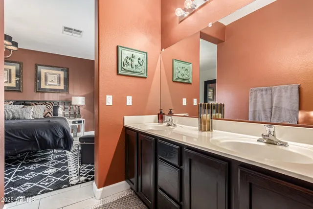 a white toilet sitting next to a bathroom sink