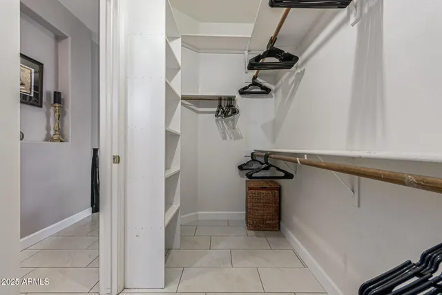 a bedroom with a bed and a television