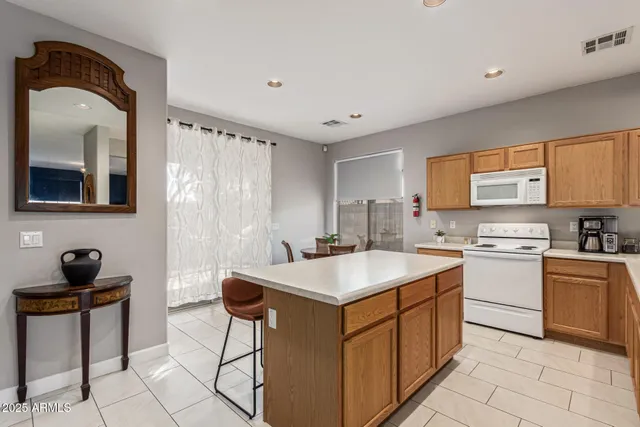 a kitchen with a sink cabinets and window
