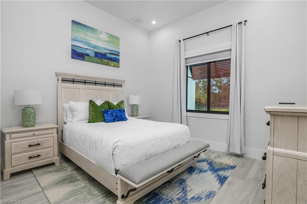 1347 23rd Street Southwest Naples, FL 34117 - Photo 13 of 50 a bedroom with a bed and a window