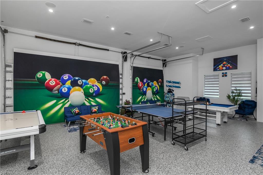 1347 23rd Street Southwest Naples, FL 34117 - Photo 32 of 50 a dining area with furniture a rug and a window