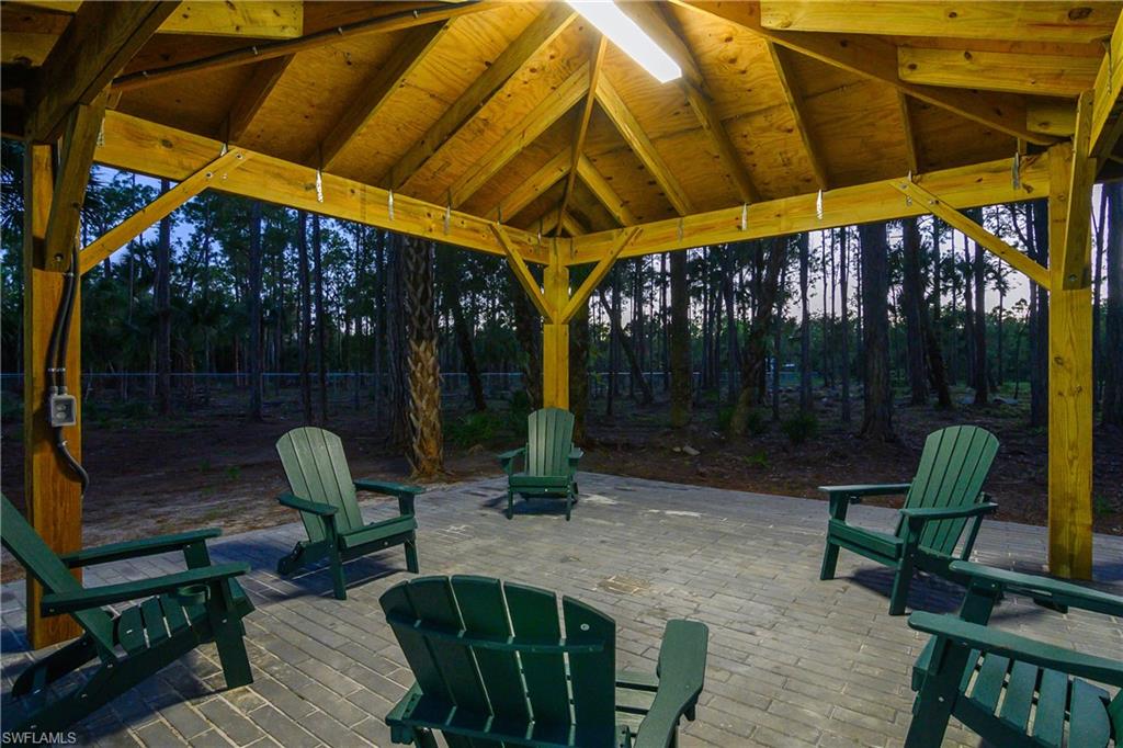 1347 23rd Street Southwest Naples, FL 34117 - Photo 36 of 50 a view of outdoor space with seating