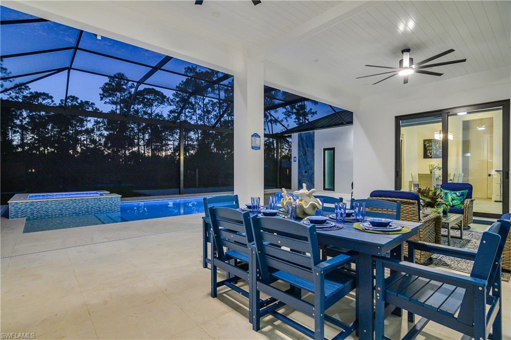1347 23rd Street Southwest Naples, FL 34117 - Photo 38 of 50 a view of a dining room with furniture and window