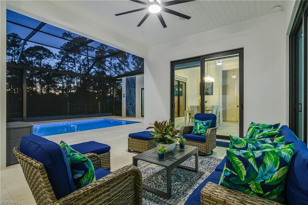 1347 23rd Street Southwest Naples, FL 34117 - Photo 39 of 50 a living room with furniture and a potted plant