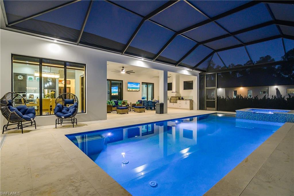 1347 23rd Street Southwest Naples, FL 34117 - Photo 44 of 50 a view of a swimming pool with a patio