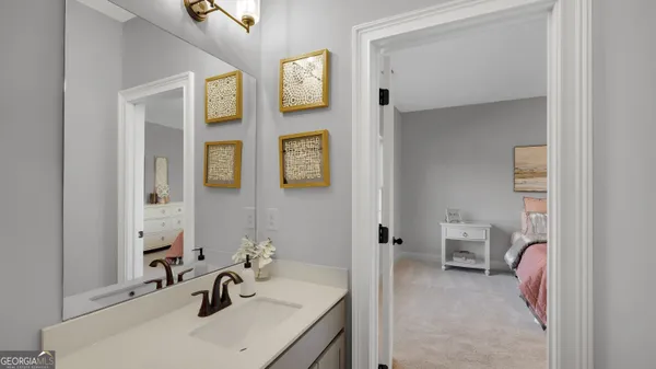 a bathroom with a sink and a mirror