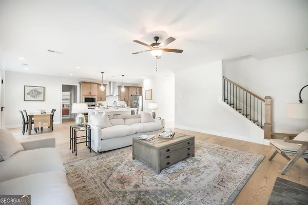 a living room with furniture and a rug