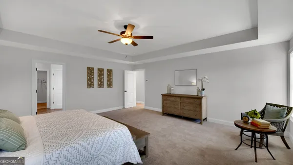 a bedroom with a bed and furniture