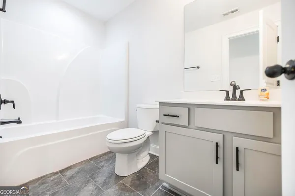 a bathroom with a sink toilet and a bathtub