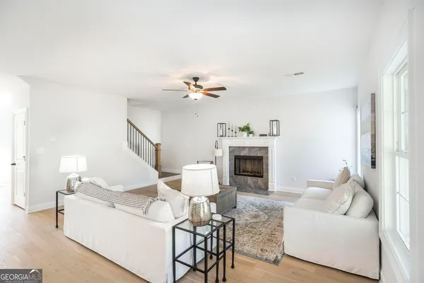 a living room with furniture and a fireplace