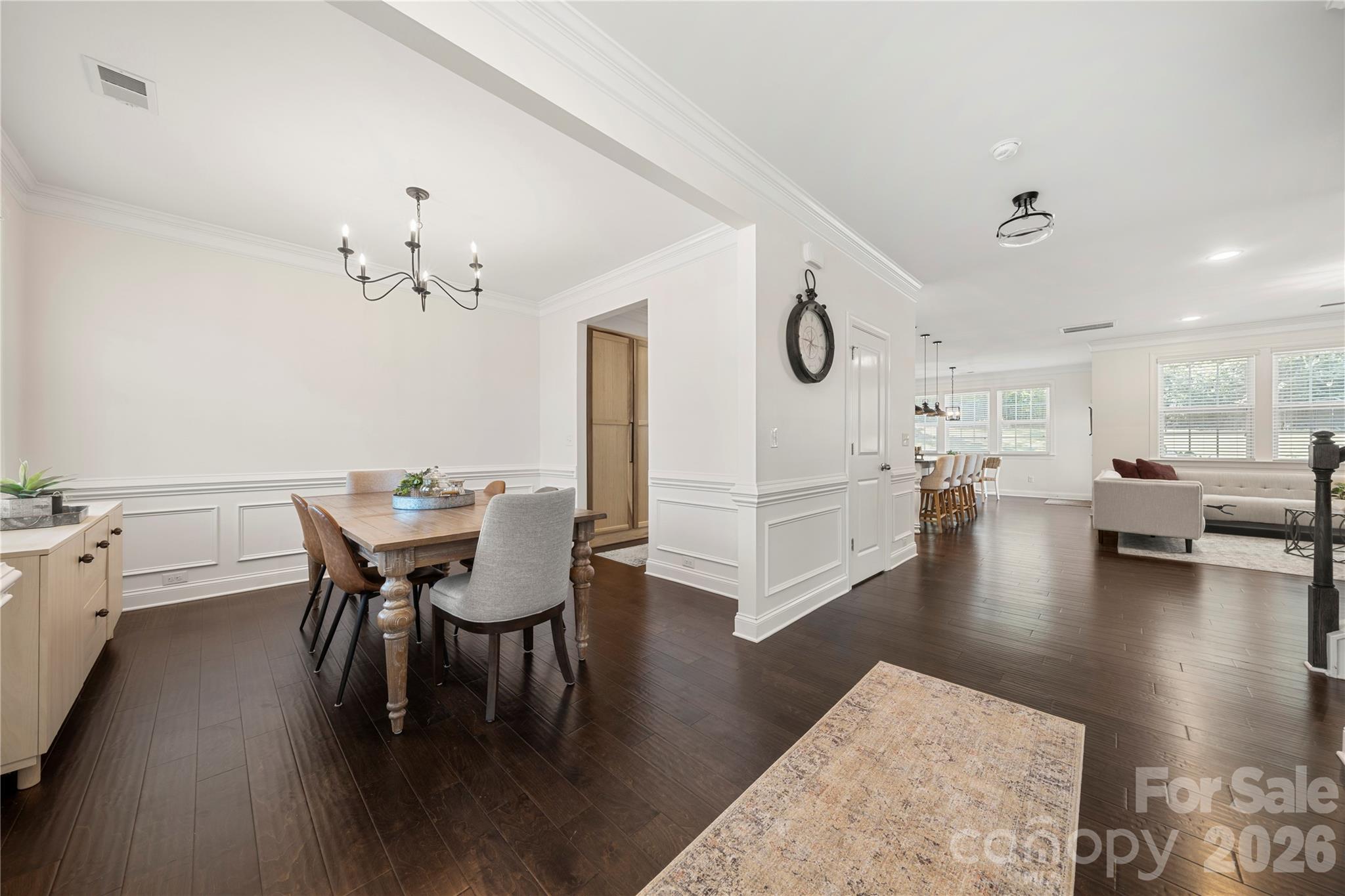 11266 Trailside Road Concord, NC 28027 - Photo 5 of 48 a view of a dining room with furniture and wooden floor