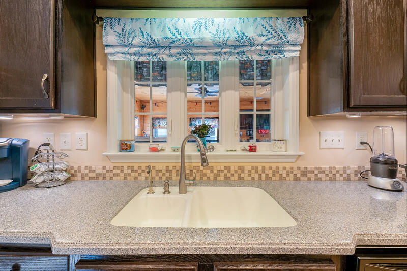 586 Foster Road Auburn, ME 04210 - Photo 20 of 70 19. Sink overlooking sunroom
