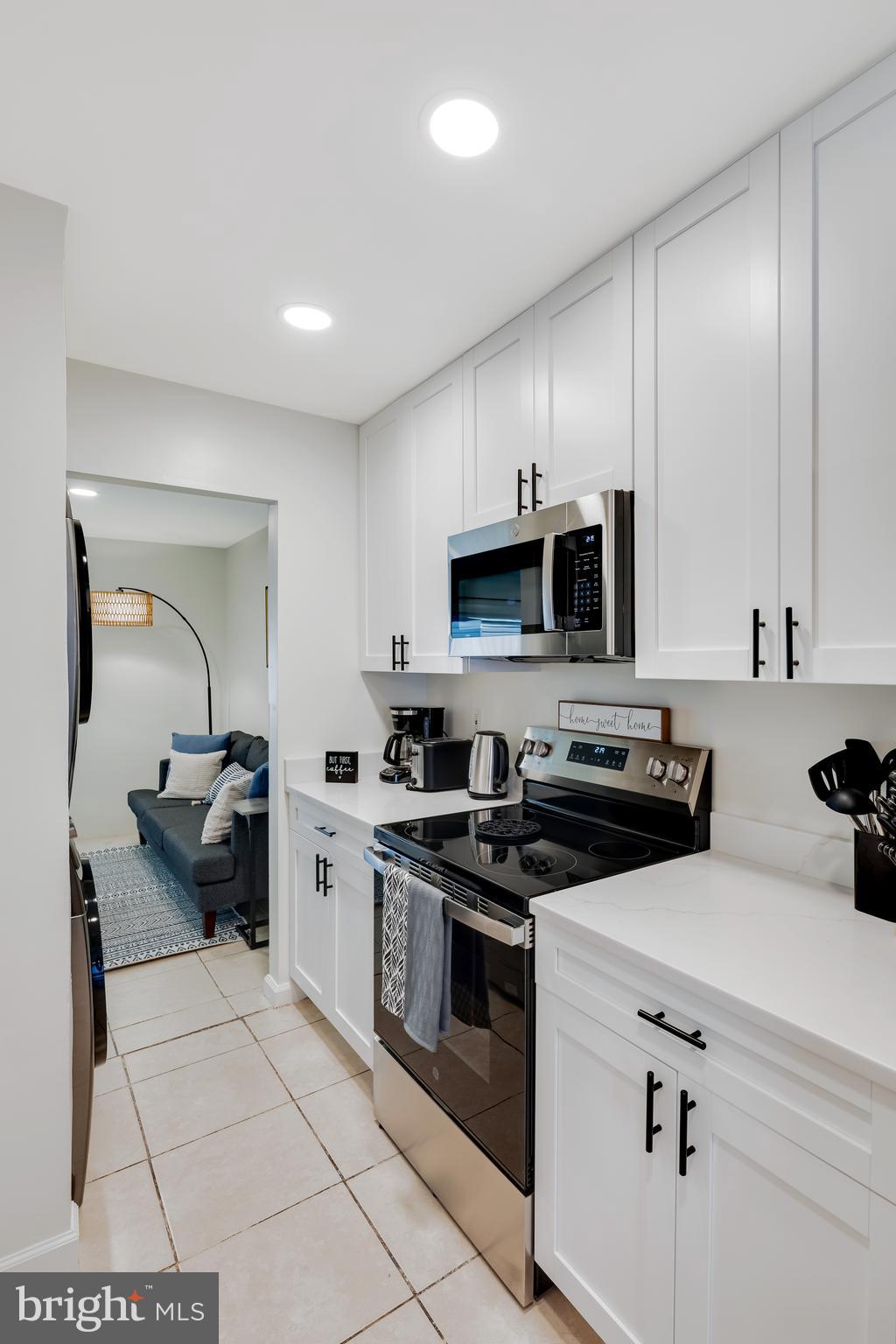 428 Reneau Way Herndon, VA 20170 - Photo 12 of 45 a kitchen with a sink a stove and cabinets
