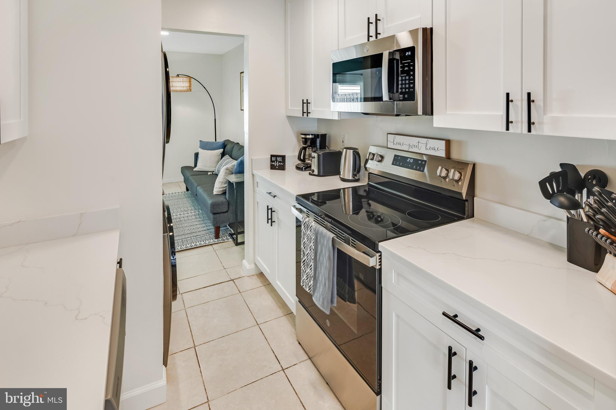 428 Reneau Way Herndon, VA 20170 - Photo 14 of 45 a kitchen that has a sink and a stove