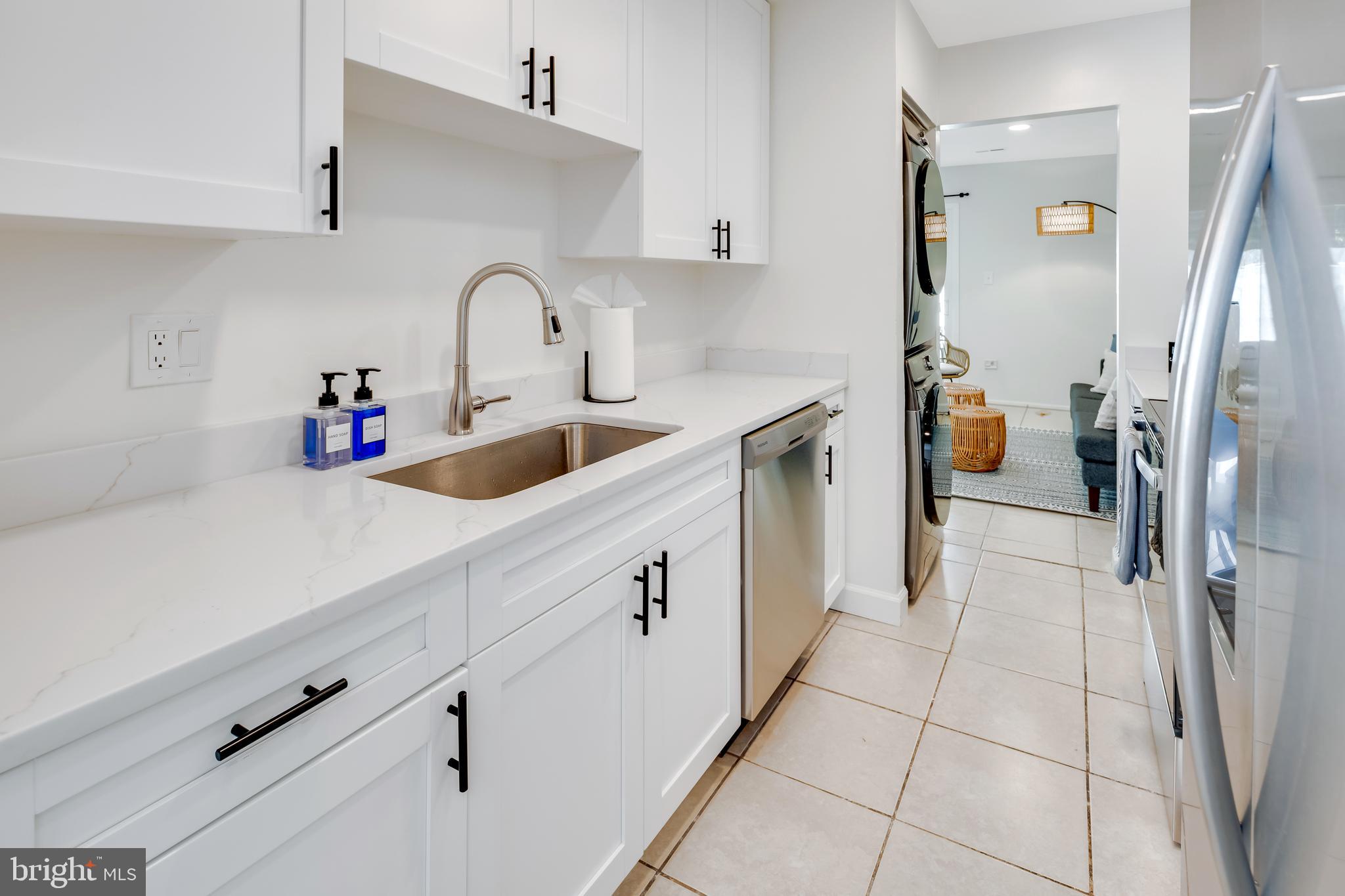 428 Reneau Way Herndon, VA 20170 - Photo 16 of 45 a kitchen with a sink and refrigerator