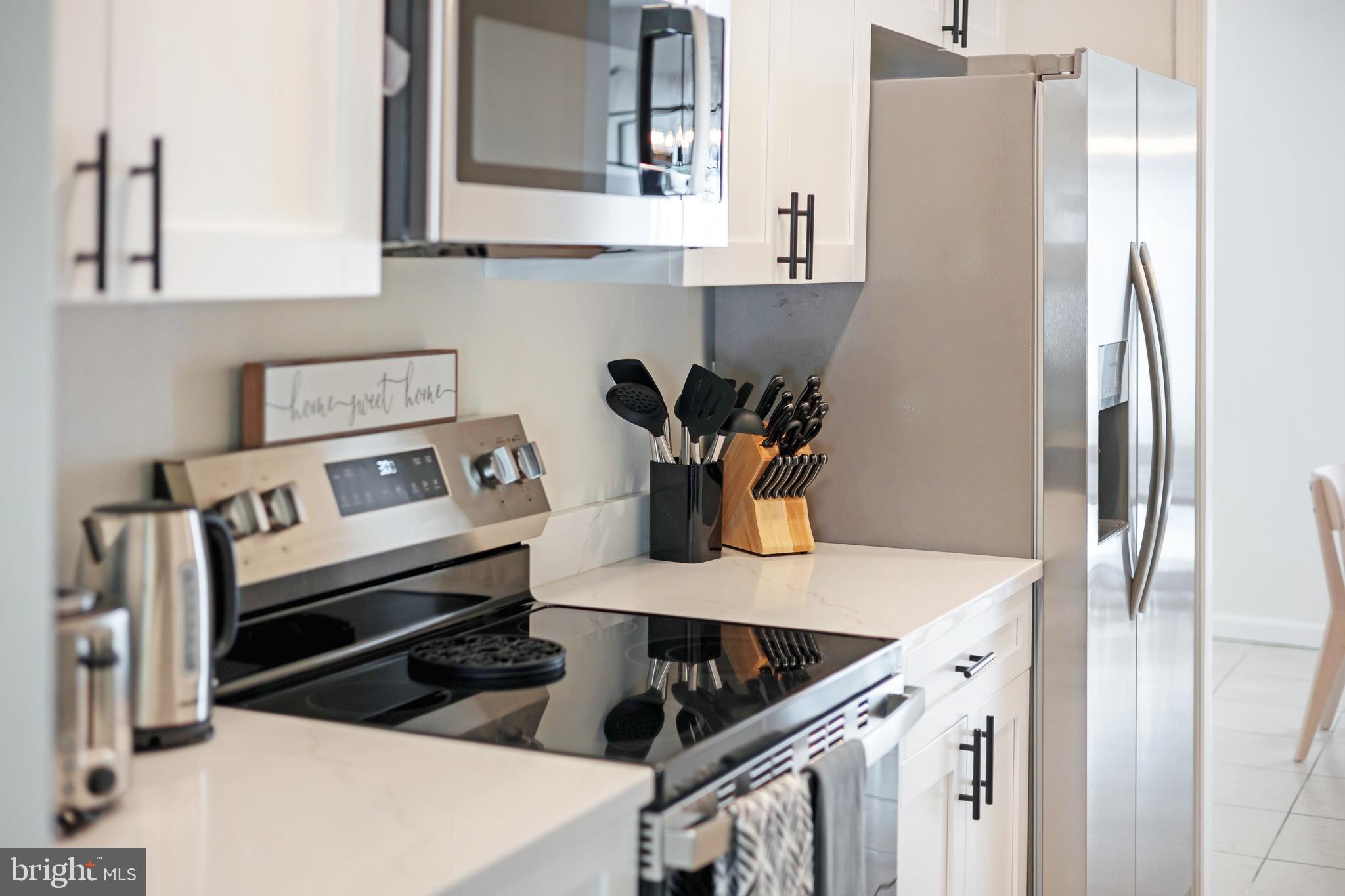 428 Reneau Way Herndon, VA 20170 - Photo 18 of 45 a kitchen with stainless steel appliances granite countertop a refrigerator and a stove