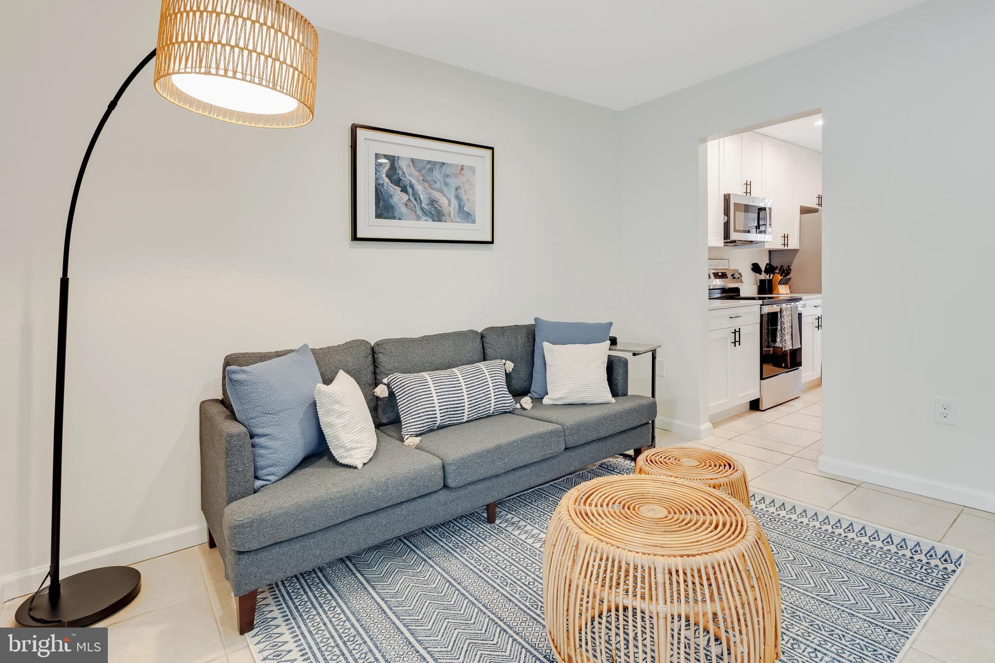 428 Reneau Way Herndon, VA 20170 - Photo 2 of 45 a living room with furniture and a wooden floor