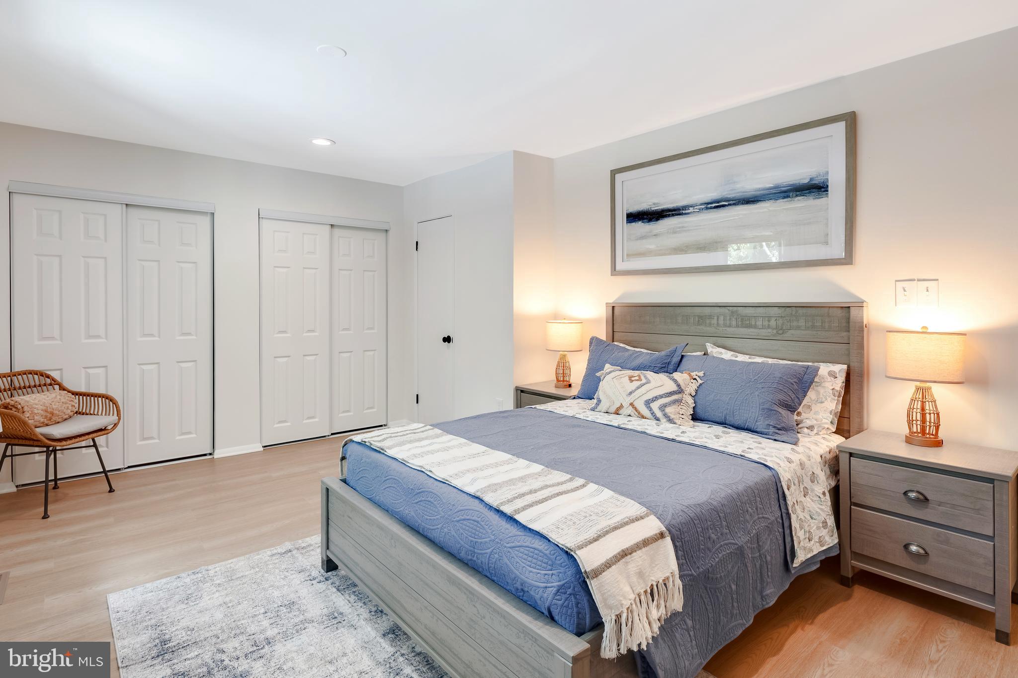 428 Reneau Way Herndon, VA 20170 - Photo 26 of 45 a spacious bedroom with a bed and a lamp