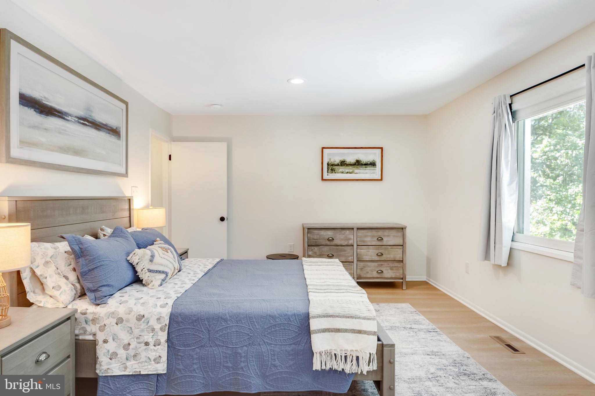 428 Reneau Way Herndon, VA 20170 - Photo 27 of 45 a bedroom with a bed and wooden floor