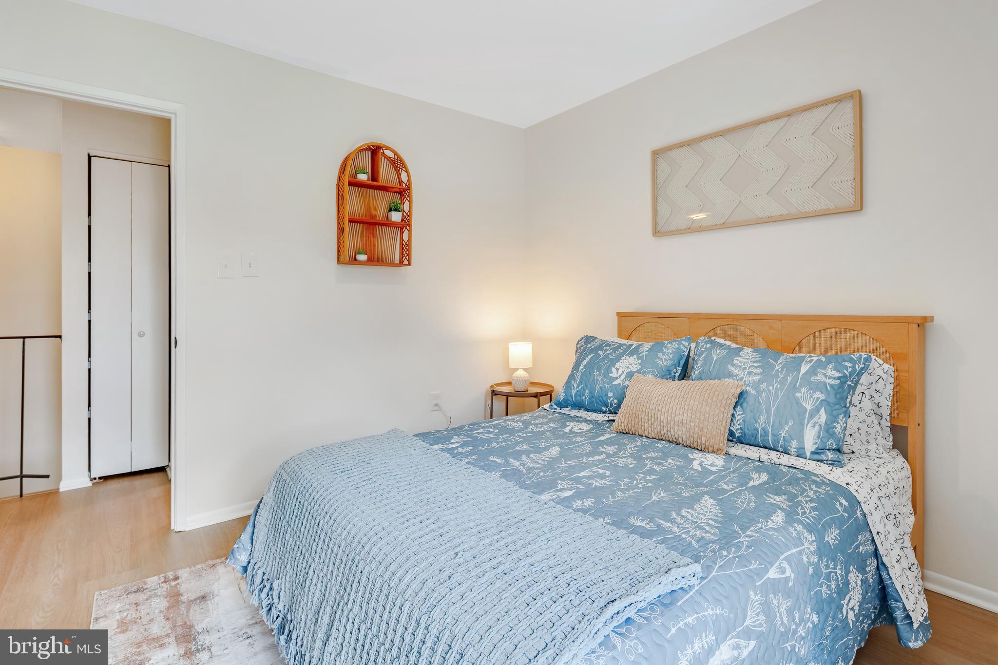 428 Reneau Way Herndon, VA 20170 - Photo 32 of 45 a bedroom with a bed and a lamp on table