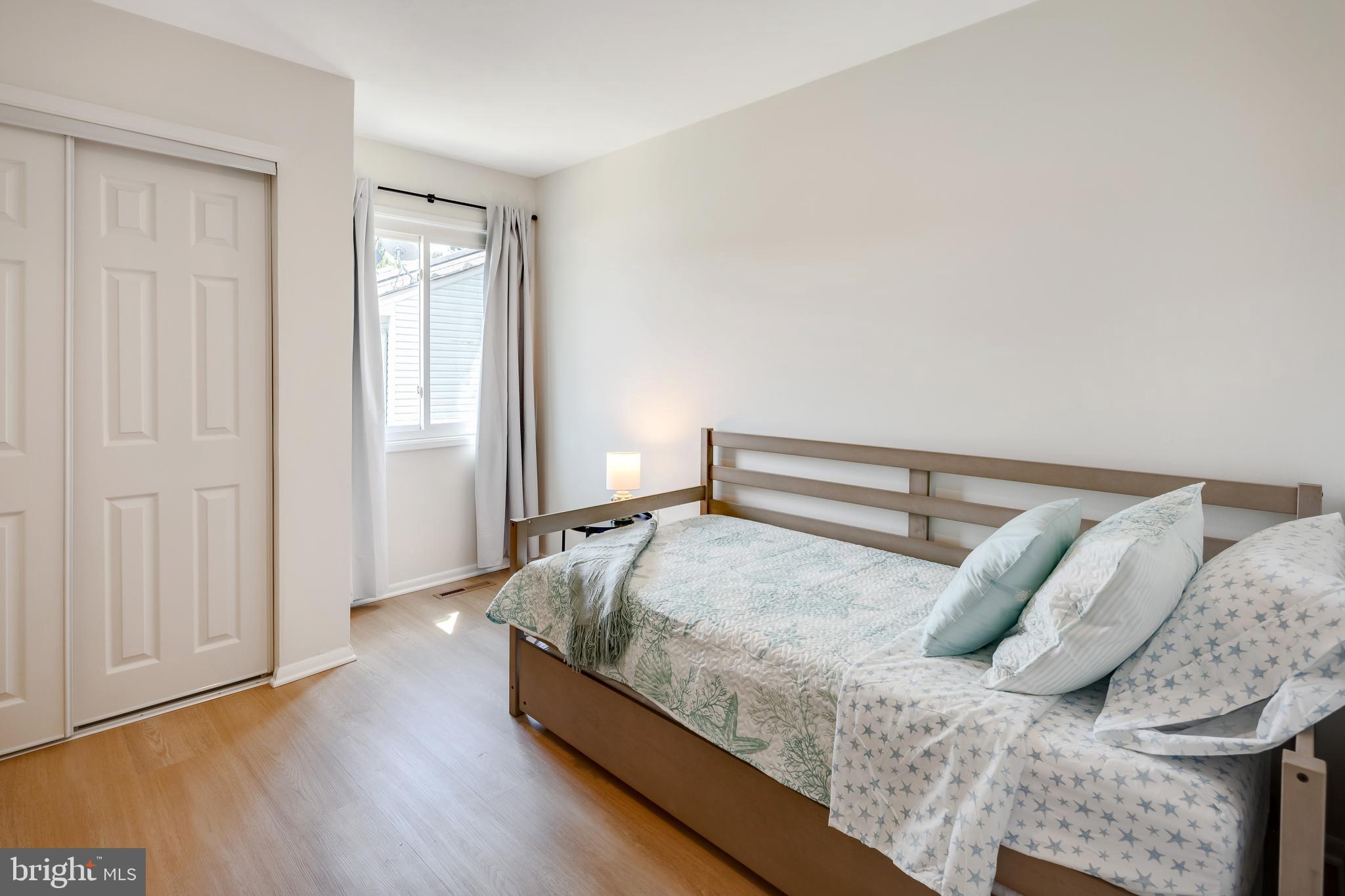 428 Reneau Way Herndon, VA 20170 - Photo 35 of 45 a bedroom with a bed and wooden floor