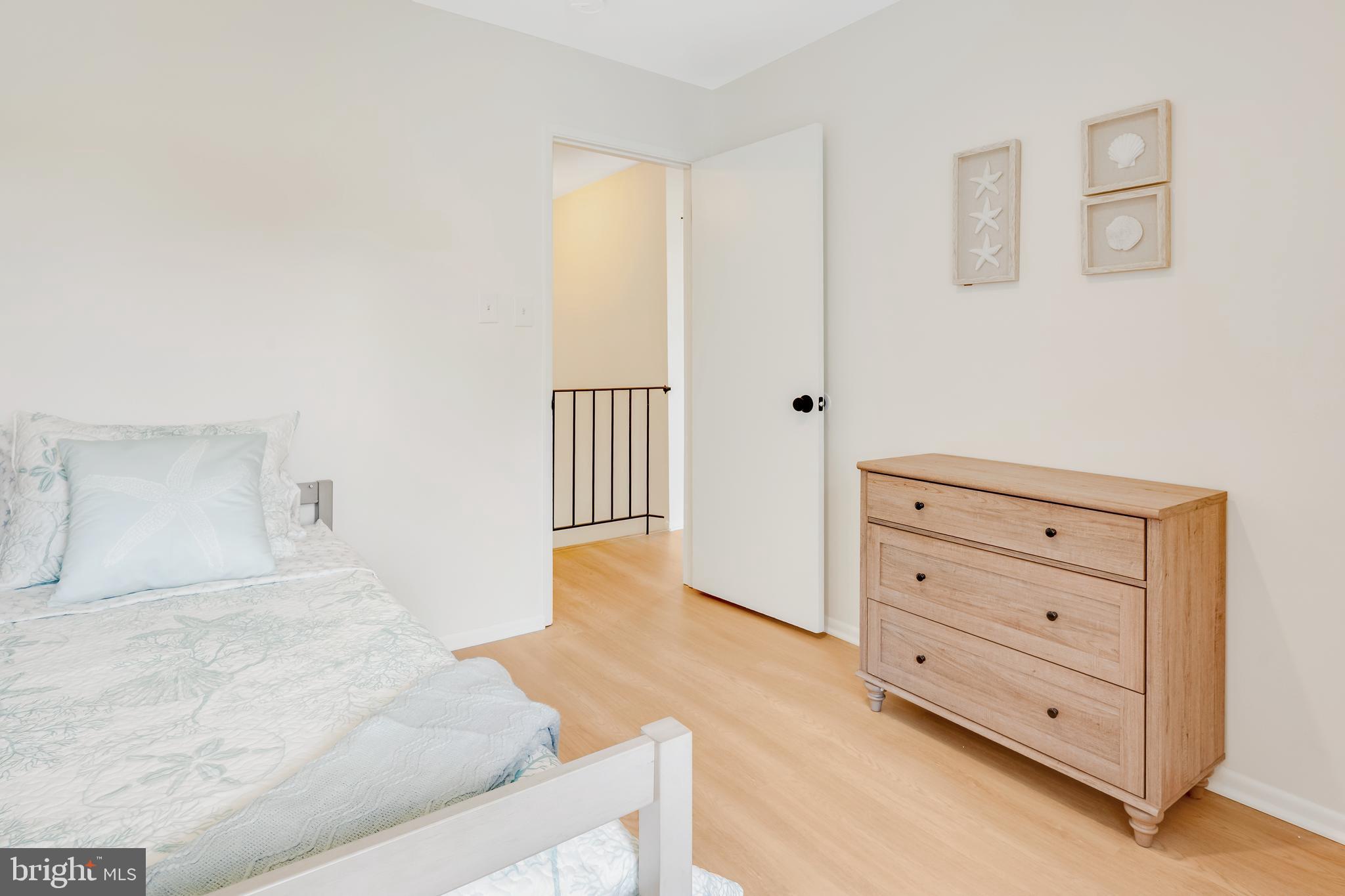 428 Reneau Way Herndon, VA 20170 - Photo 36 of 45 a bedroom with a bed and a dresser