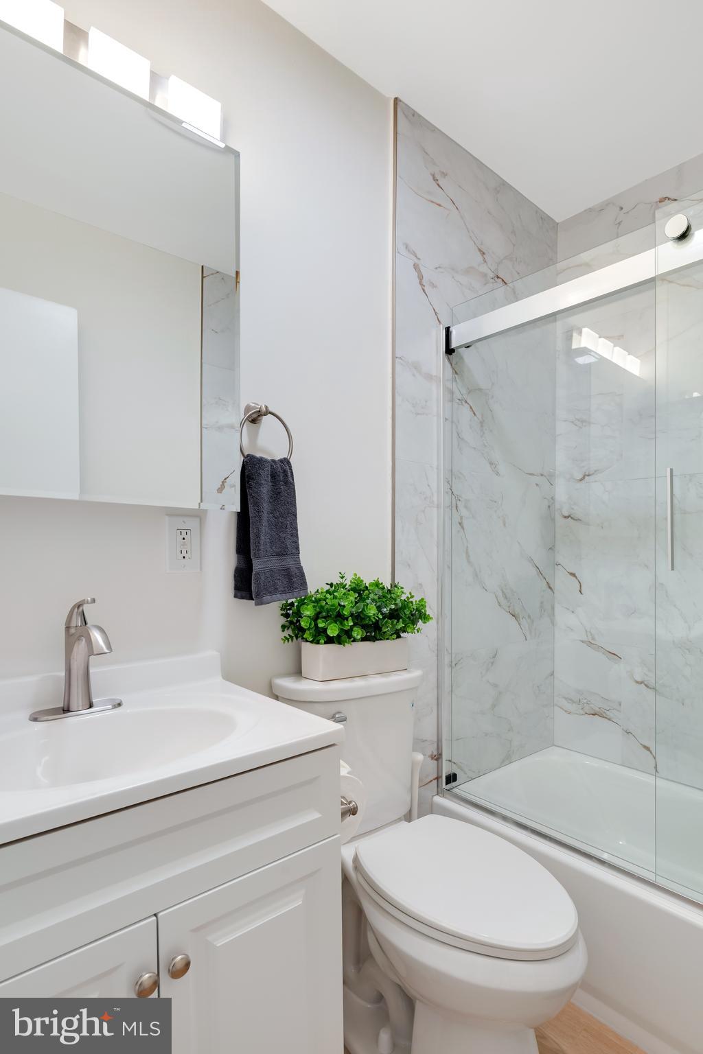 428 Reneau Way Herndon, VA 20170 - Photo 37 of 45 a bathroom with a sink a toilet and shower