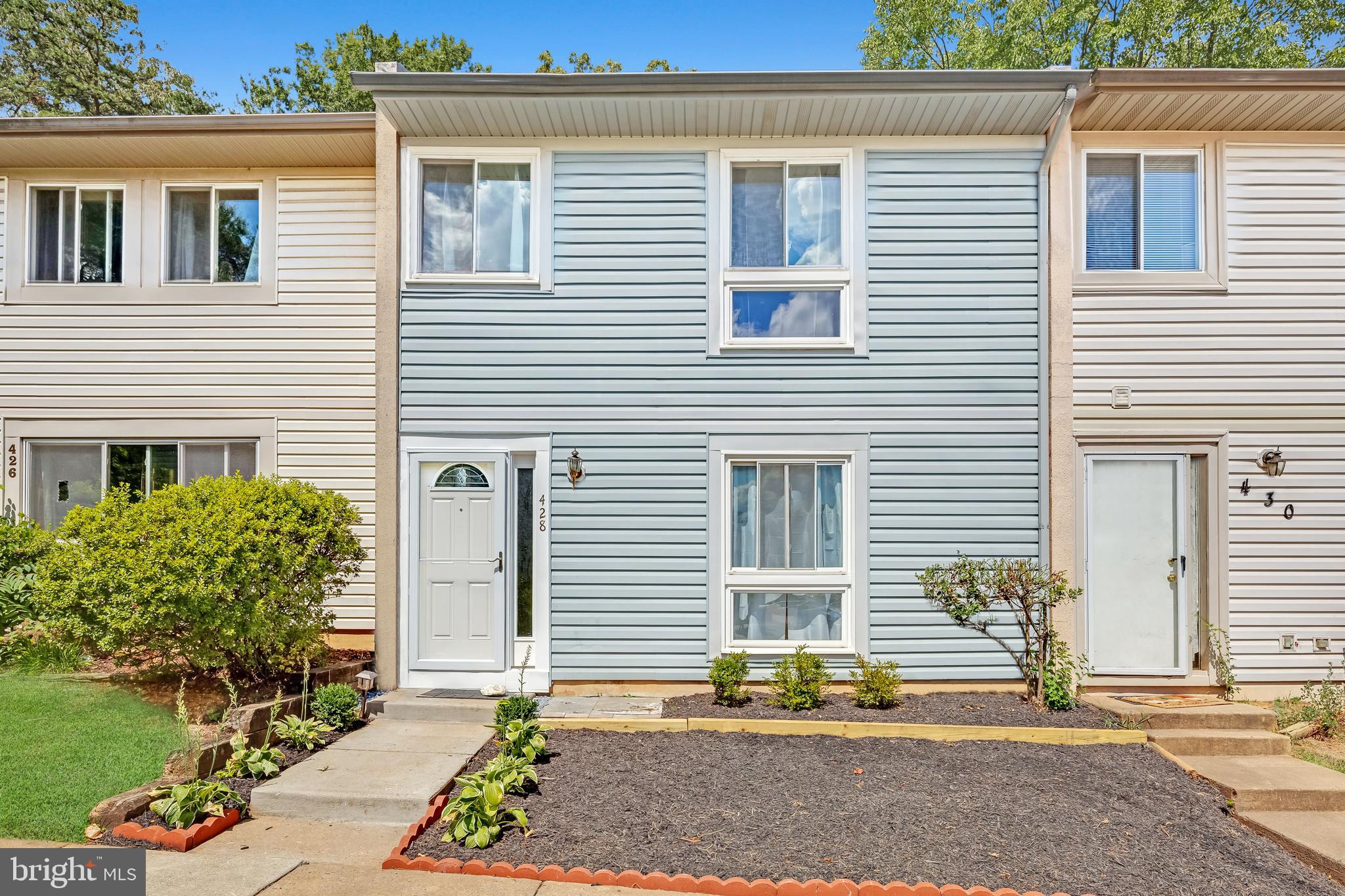 428 Reneau Way Herndon, VA 20170 - Photo 39 of 45 a front view of a house with garden
