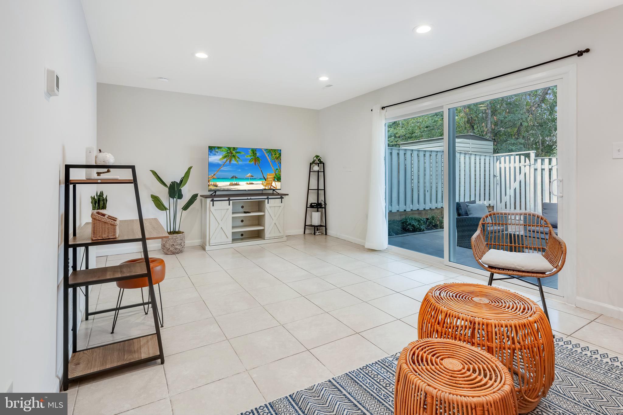 428 Reneau Way Herndon, VA 20170 - Photo 6 of 45 a living room with furniture a flat screen tv and floor to ceiling window