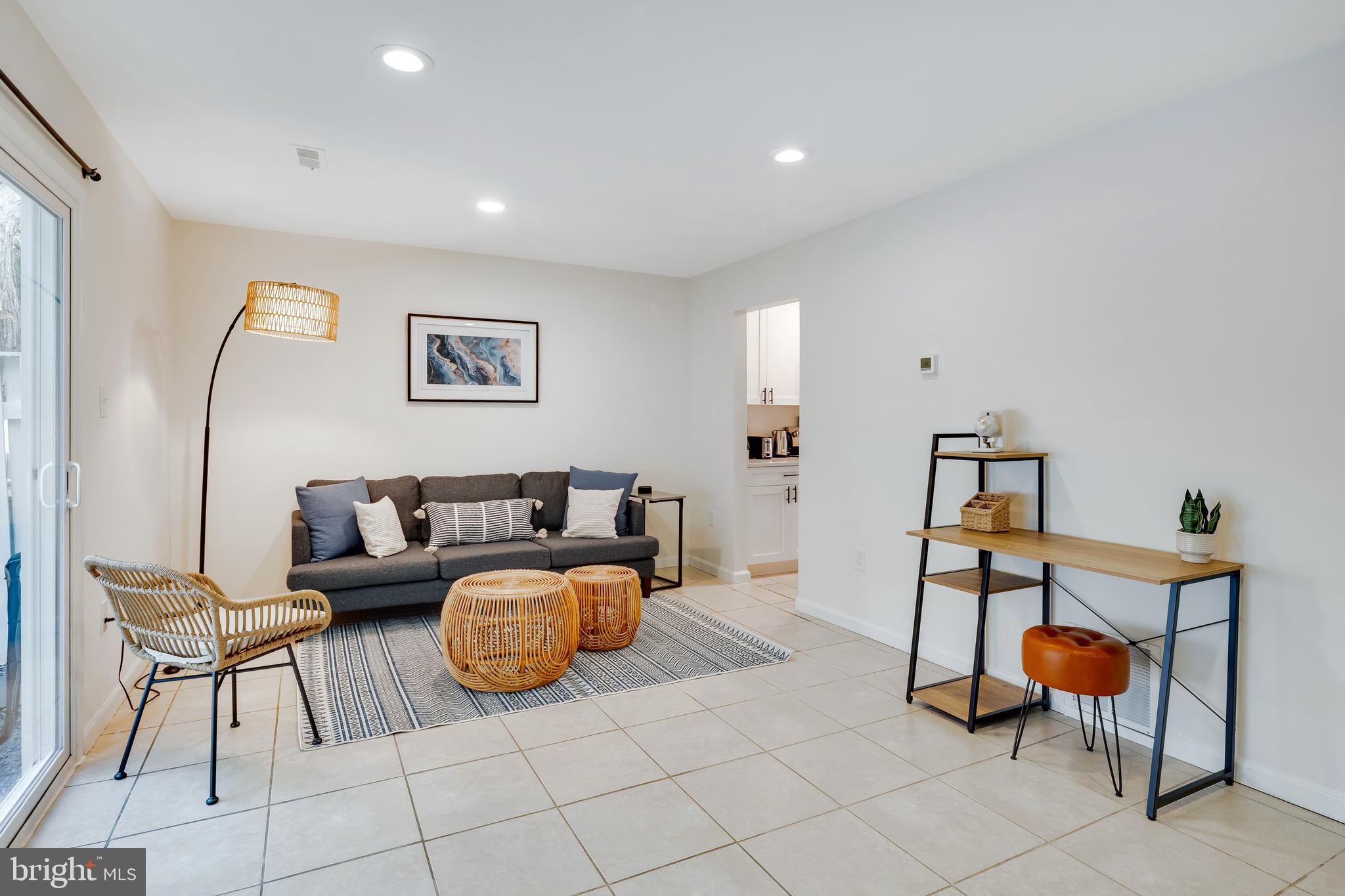 428 Reneau Way Herndon, VA 20170 - Photo 8 of 45 a living room with furniture a rug and a chandelier