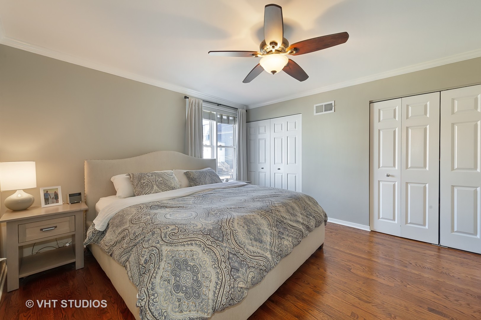 1346 West Fillmore Street, Unit B Chicago, IL 60607 - Photo 8 of 18 a bedroom with a bed and a chandelier