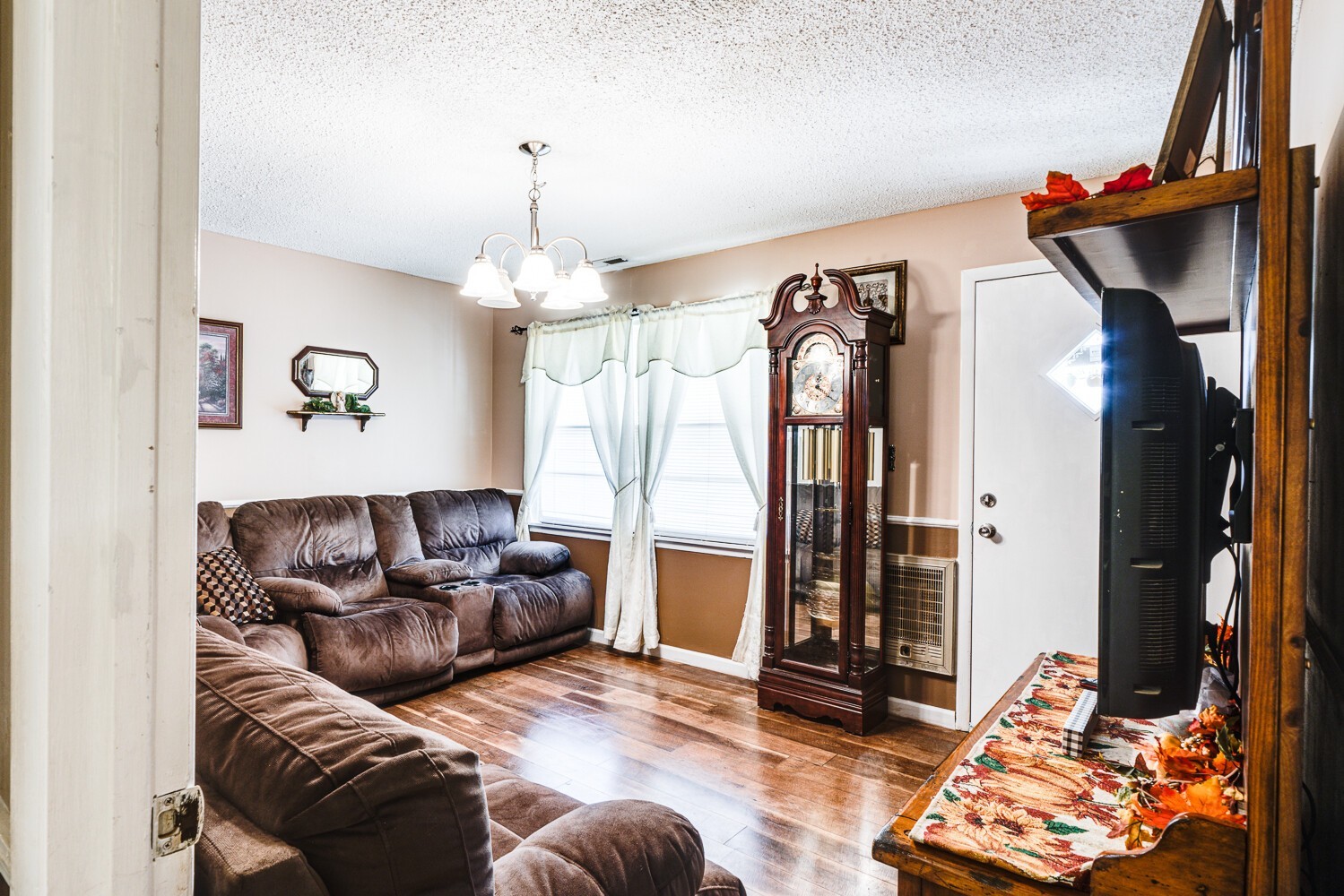 2757 Dale Ridge Road Dowelltown, TN 37059 - Photo 13 of 28 a living room with furniture and a chandelier