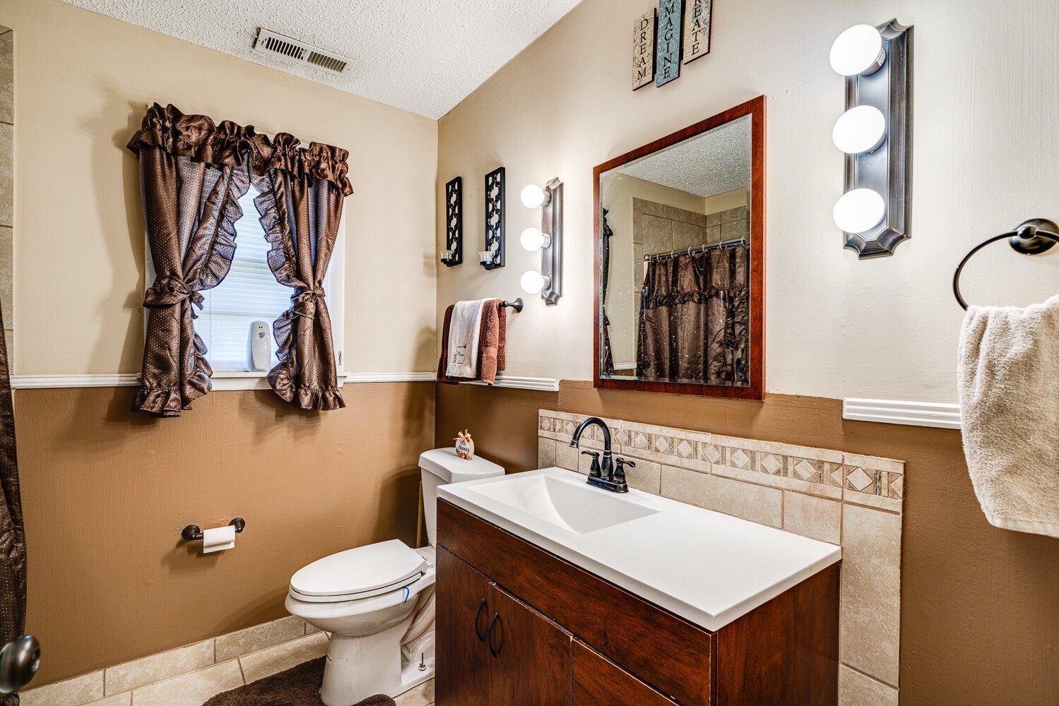 2757 Dale Ridge Road Dowelltown, TN 37059 - Photo 22 of 28 a bathroom with a sink a toilet and a mirror