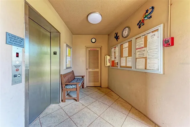 a view of a hallway and an entryway with dining area
