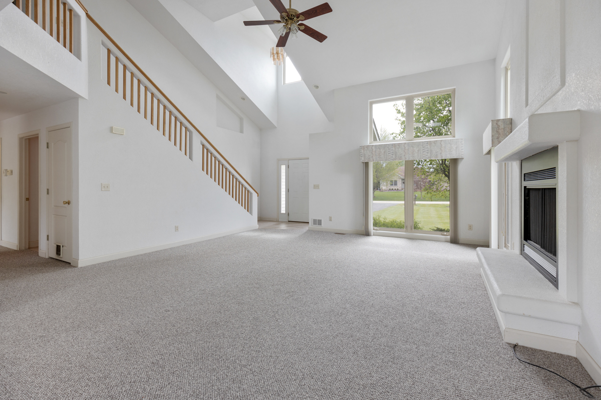17717 Springbrook Circle Union, IL 60180 - Photo 13 of 33 a view of a livingroom with a ceiling fan and window