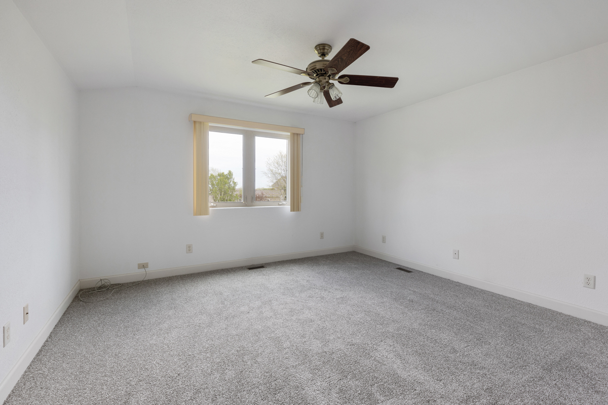 17717 Springbrook Circle Union, IL 60180 - Photo 16 of 33 an empty room with a window and a fan
