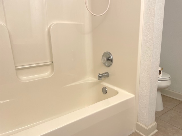 17717 Springbrook Circle Union, IL 60180 - Photo 18 of 33 a bathroom with a white bath tub and a shower