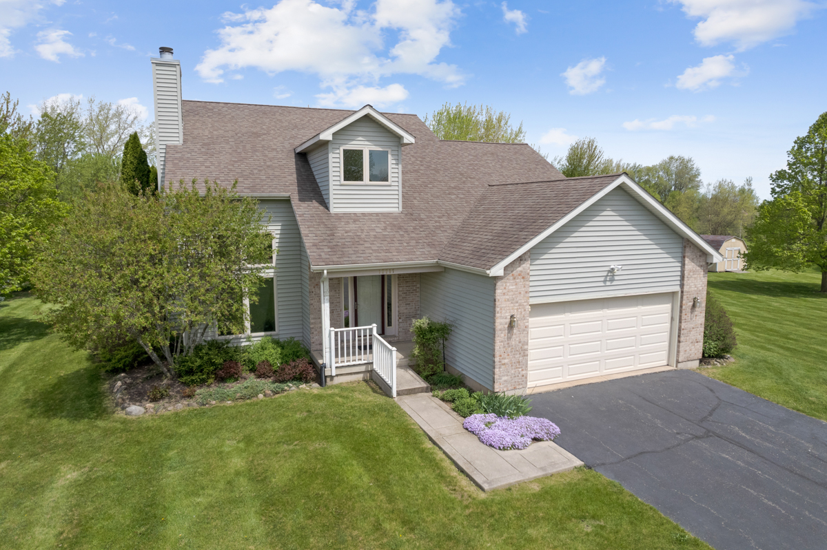17717 Springbrook Circle Union, IL 60180 - Photo 21 of 33 a front view of a house with a garden