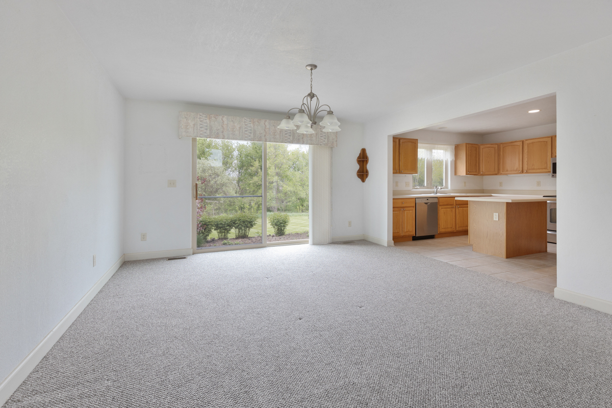 17717 Springbrook Circle Union, IL 60180 - Photo 4 of 33 a view of a kitchen with a sink cabinets and a floor to ceiling window