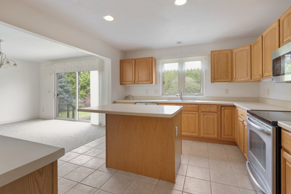 17717 Springbrook Circle Union, IL 60180 - Photo 5 of 33 a kitchen with stainless steel appliances granite countertop a sink counter space cabinets and a window