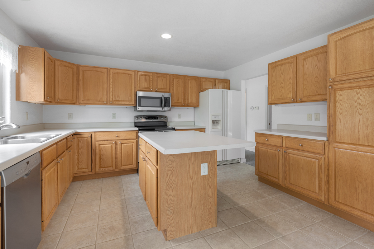 17717 Springbrook Circle Union, IL 60180 - Photo 7 of 33 a kitchen with cabinets and white stainless steel appliances