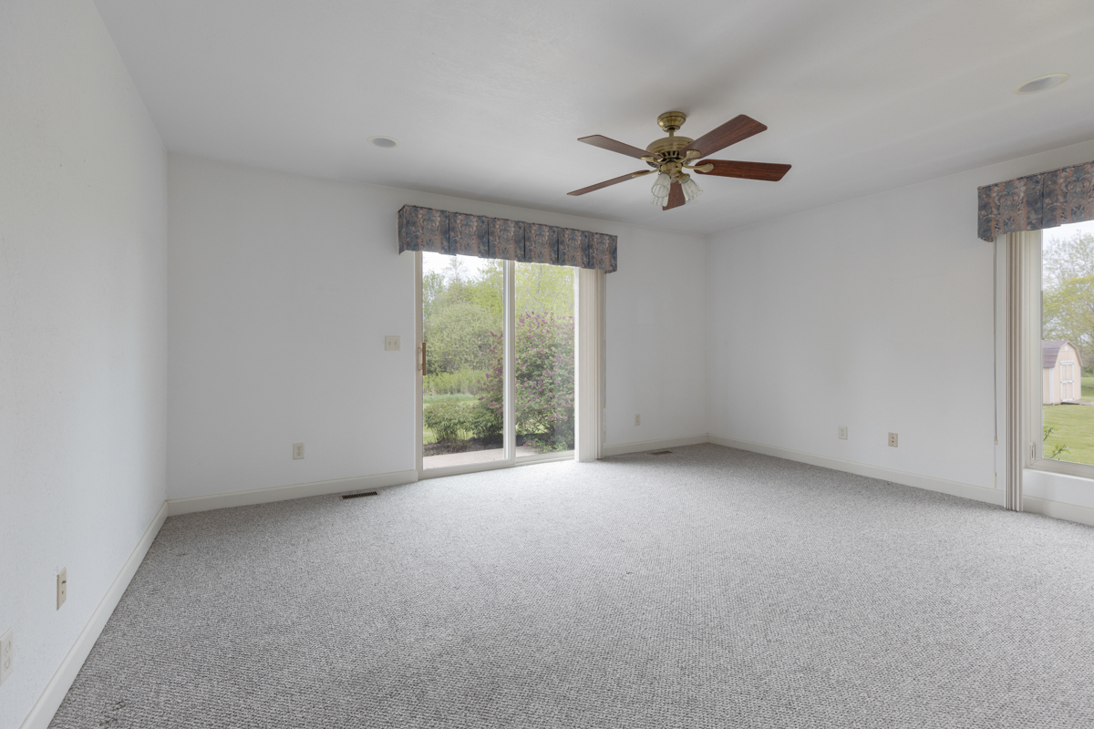 17717 Springbrook Circle Union, IL 60180 - Photo 8 of 33 an empty room with windows and fan