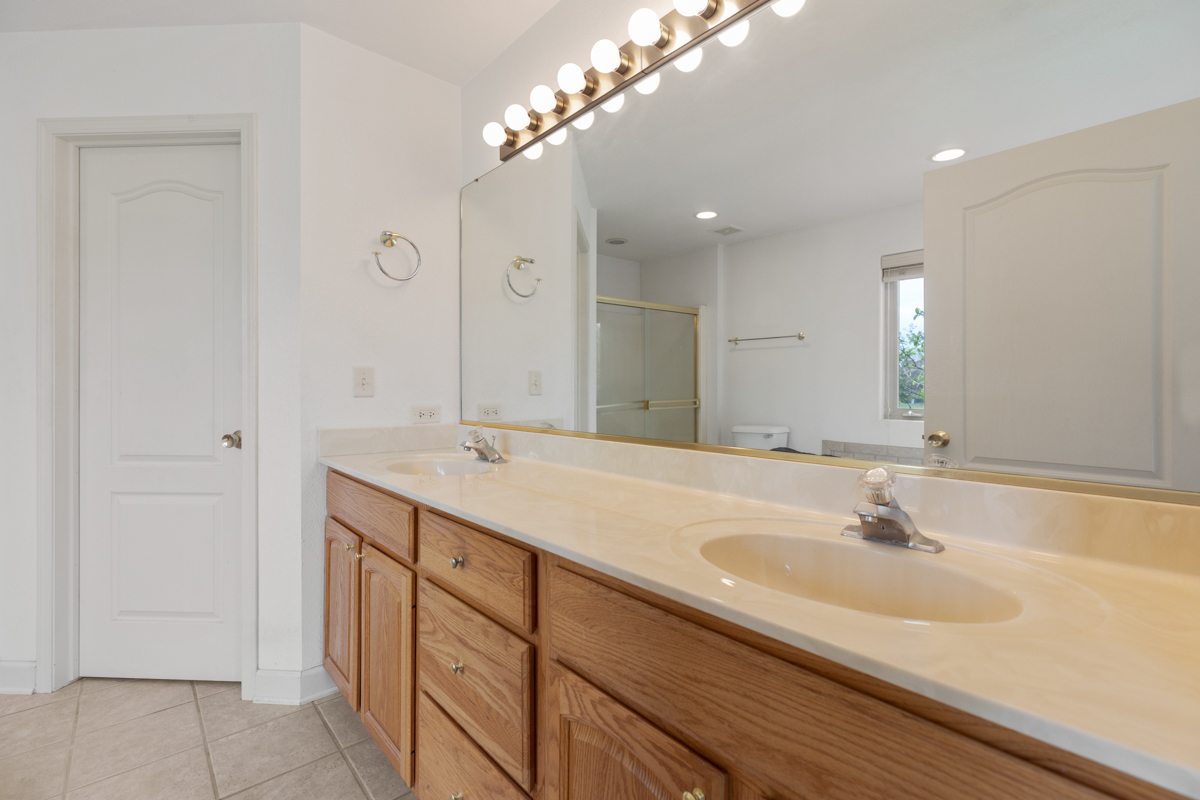 17717 Springbrook Circle Union, IL 60180 - Photo 9 of 33 a bathroom with a sink and a mirror
