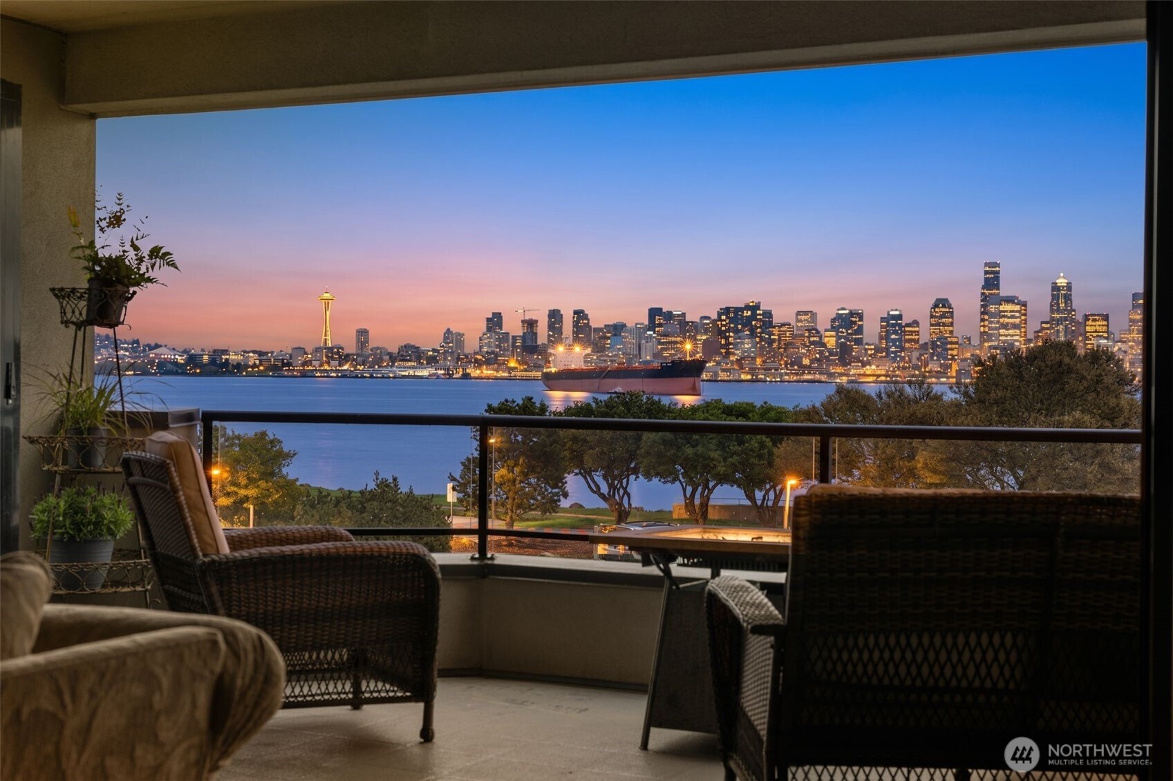 a view of a chairs and table in a balcony
