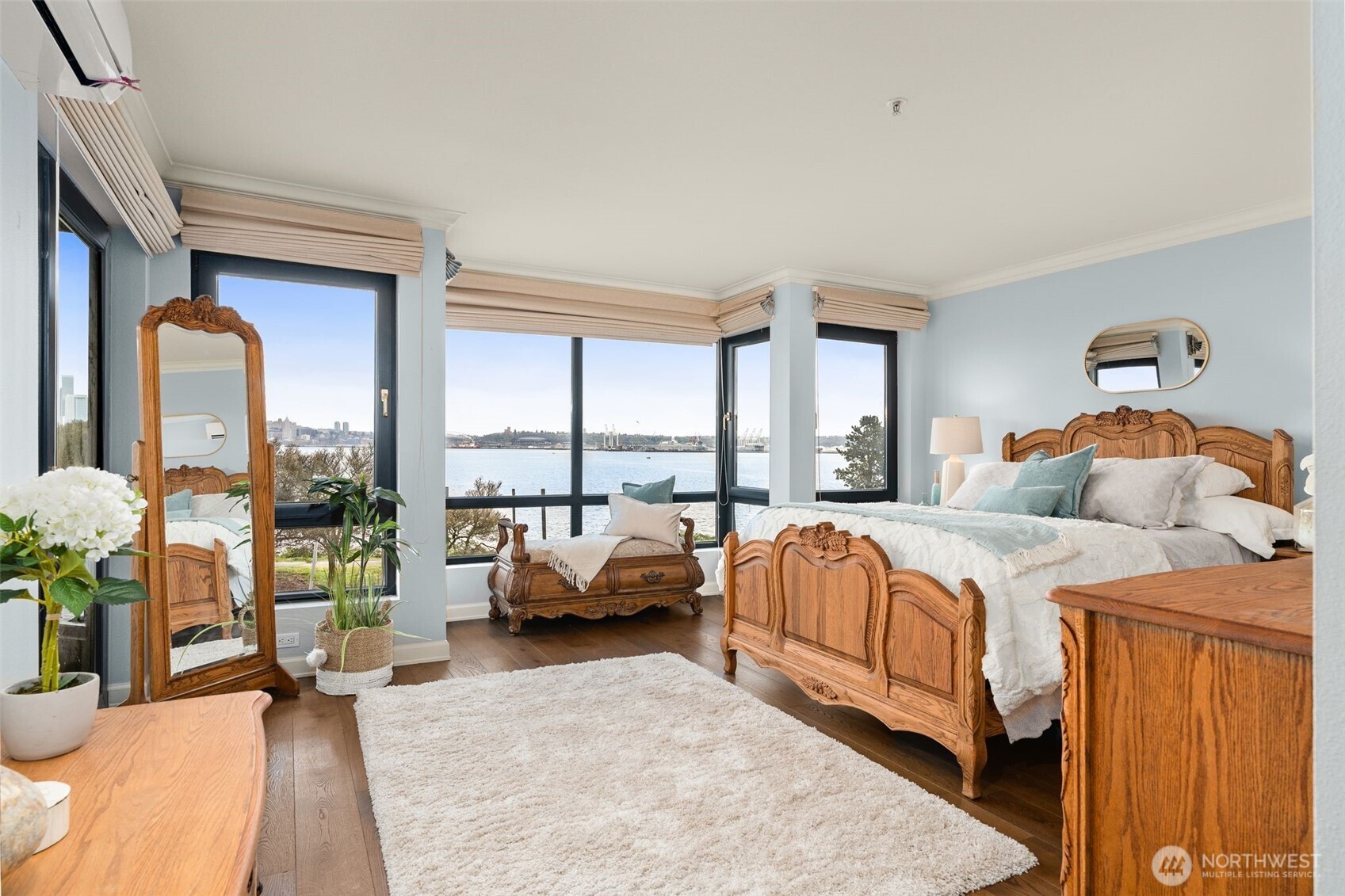 1333 Harbor Avenue Southwest, Unit 204 Seattle, WA 98116 - Photo 15 of 27 a bedroom with a bed and large windows