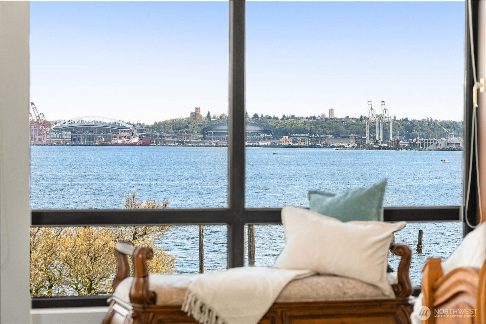 1333 Harbor Avenue Southwest, Unit 204 Seattle, WA 98116 - Photo 16 of 27 a view of a lake from a balcony