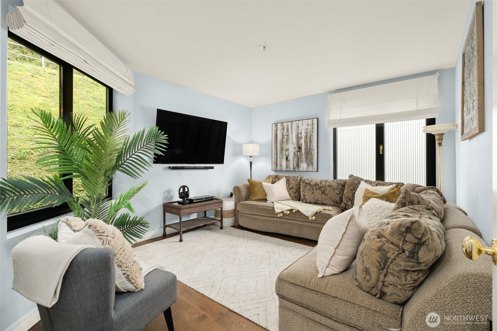 1333 Harbor Avenue Southwest, Unit 204 Seattle, WA 98116 - Photo 23 of 27 a living room with furniture and a flat screen tv