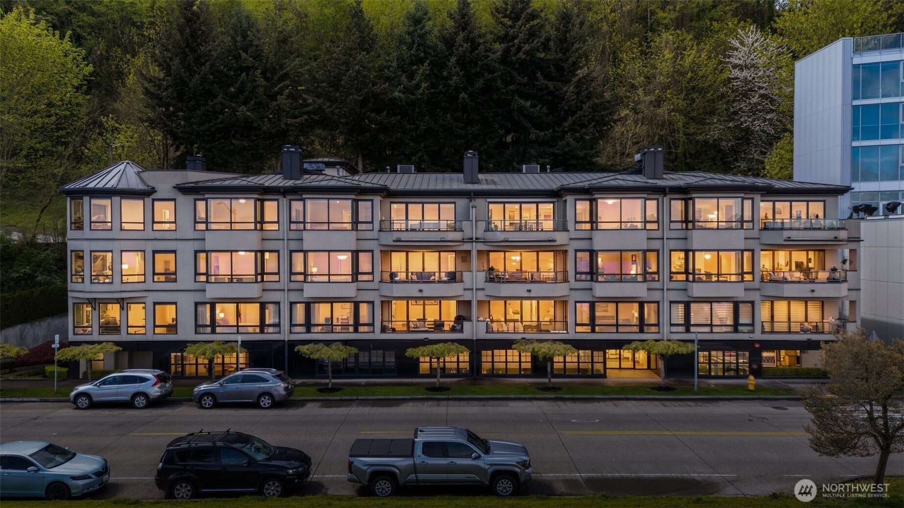 1333 Harbor Avenue Southwest, Unit 204 Seattle, WA 98116 - Photo 27 of 27 a front view of a building with a garden